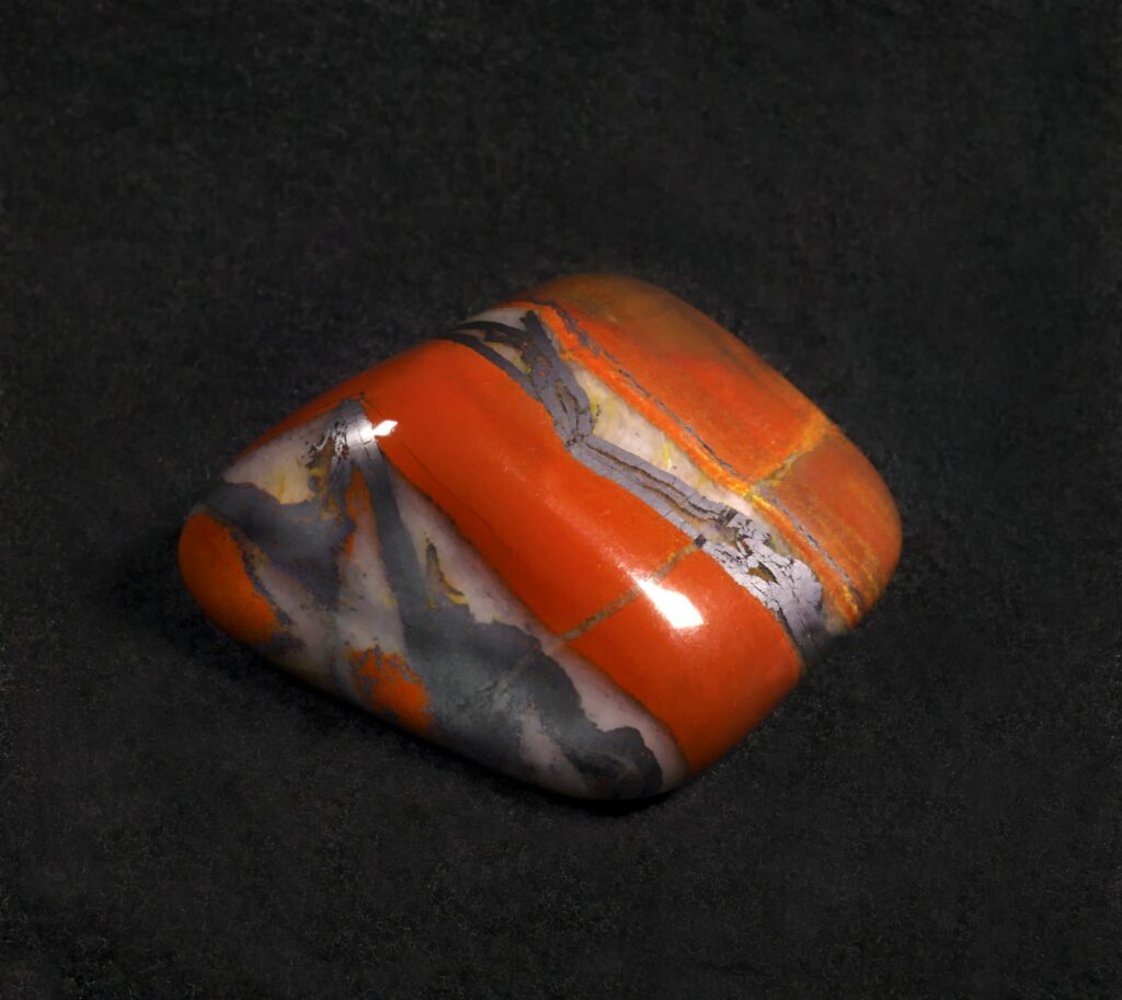 Jasper polished stone on black background